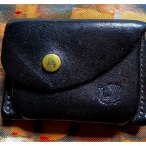 Small black wallet, worn lovingly.